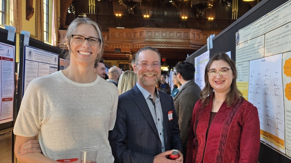 three people smiling