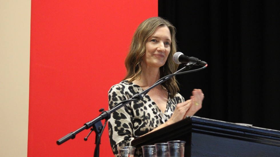 Audrey Tyrka, MD, PhD, at the podium