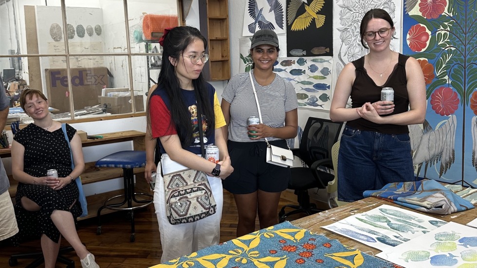 people looking at textiles