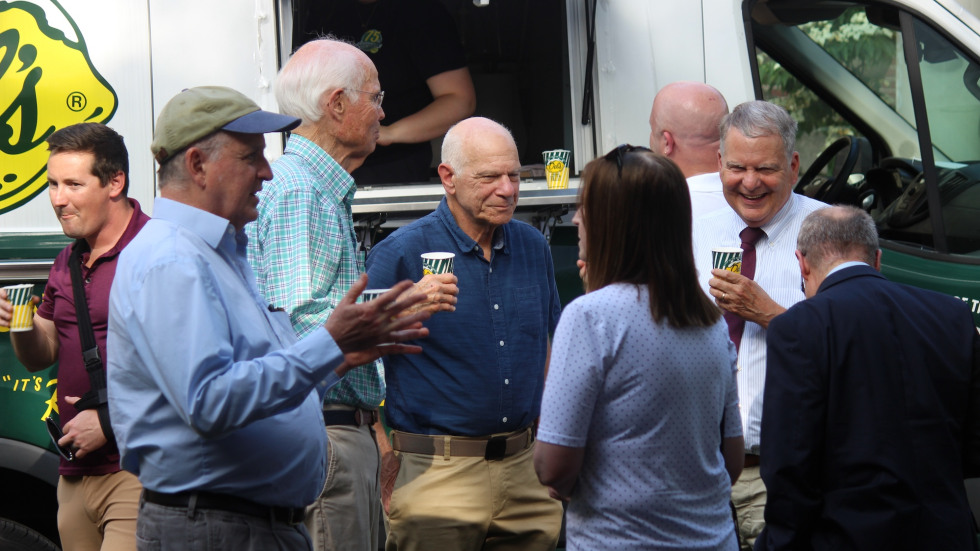 group talking in front of Del's truck
