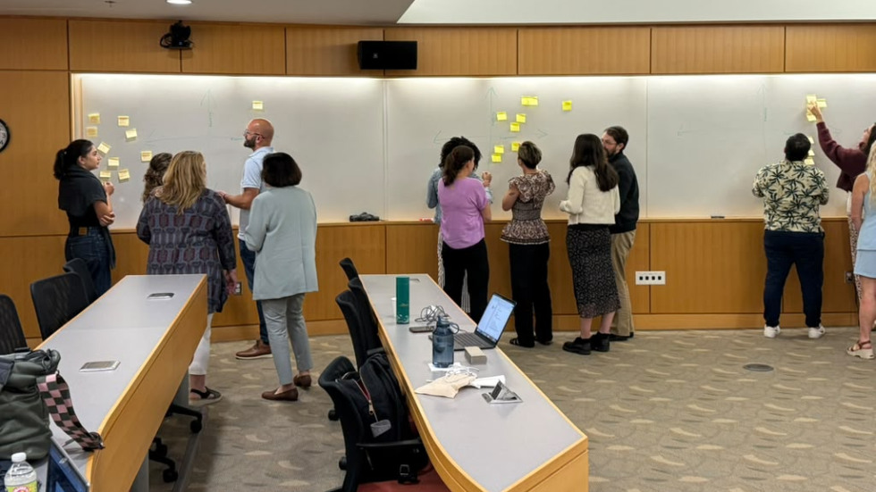 Participants collaborate on a process mapping activity during the Advanced Implementation Methods Workshop to identify implementation challenges and opportunities for improvement.