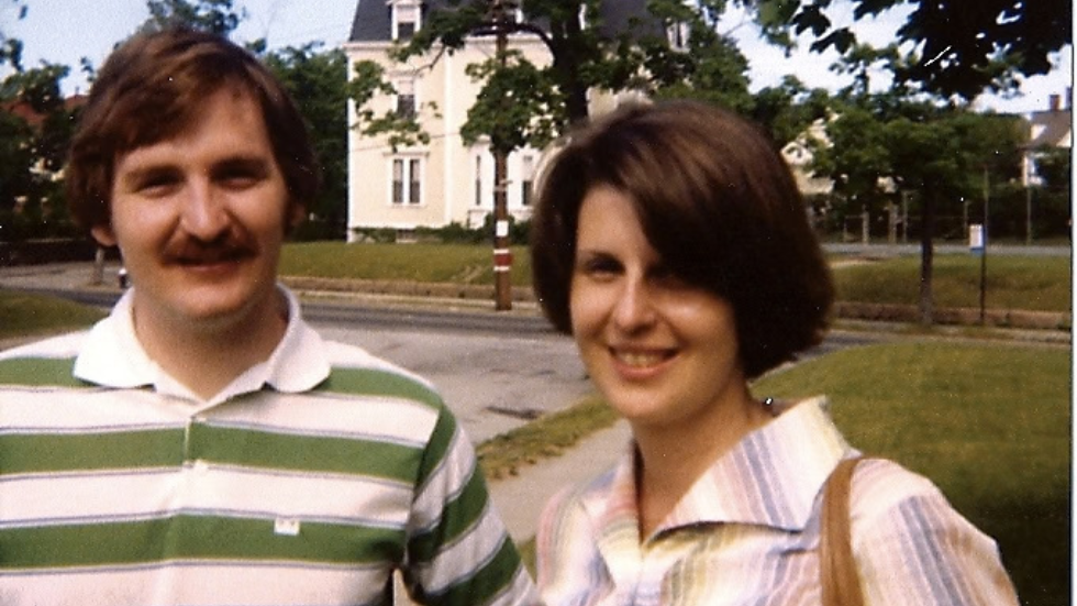 two people standing outside